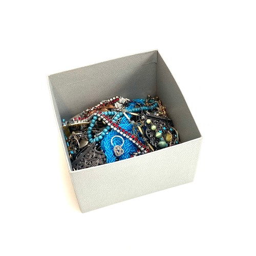 13 - A mixed lot of costume jewellery to include gold and silver tone chains, red and white paste necklac... 