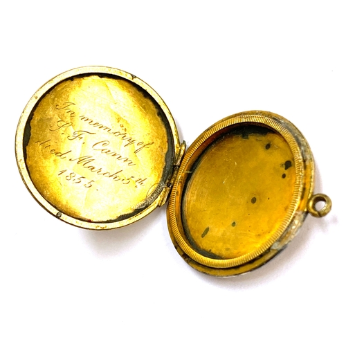 55A - A Victorian yellow metal locket, engraved 'In Memory of L.F Cann, died March 5th 1855', 2.3cmD, gros... 