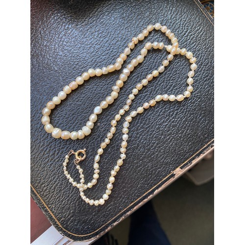 26 - A late 19th/early 20th century natural saltwater pearl necklace, the pearls ranging from 1.5mm to 5.... 