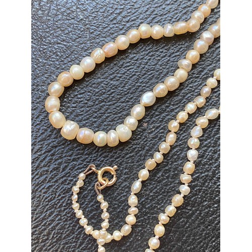 26 - A late 19th/early 20th century natural saltwater pearl necklace, the pearls ranging from 1.5mm to 5.... 
