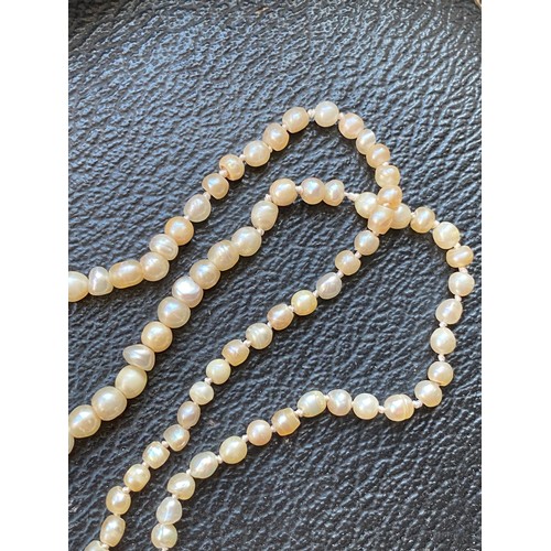 26 - A late 19th/early 20th century natural saltwater pearl necklace, the pearls ranging from 1.5mm to 5.... 