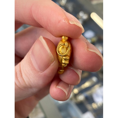 11 - Two Chinese 24ct gold pendants, one in the form of a peanut, gross weight 6g