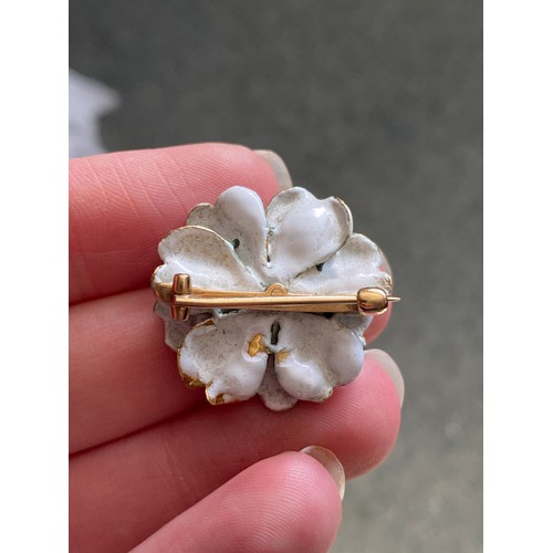 15 - A late 19th/early 20th century gold and enamel brooch in the form of a white peony, unmarked but tes... 