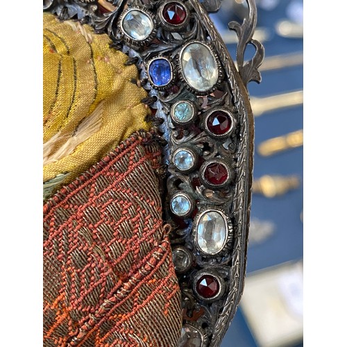 33 - A late 19th/early 20th century ornately pierced silver purse frame set with multiple gemstones to in... 