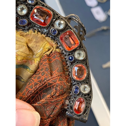 33 - A late 19th/early 20th century ornately pierced silver purse frame set with multiple gemstones to in... 