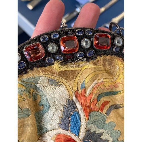 33 - A late 19th/early 20th century ornately pierced silver purse frame set with multiple gemstones to in... 