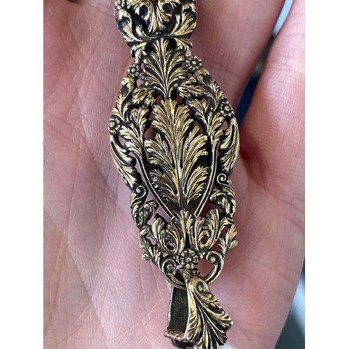32 - A pair of 19th century gold and silver lorgnettes, of pierced foliate form, bezel set with three sap... 