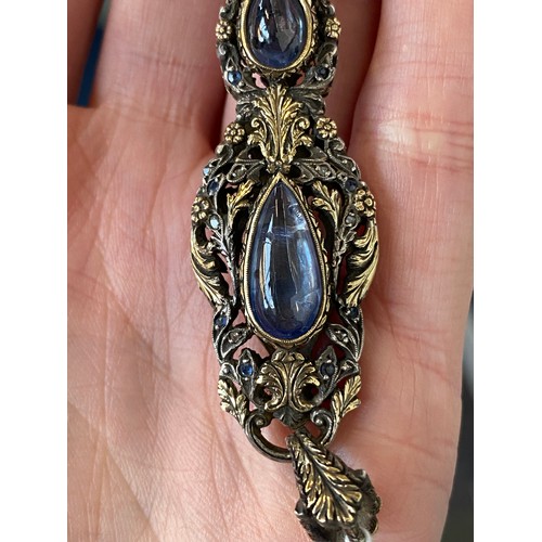 32 - A pair of 19th century gold and silver lorgnettes, of pierced foliate form, bezel set with three sap... 