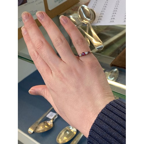 6 - An early 20th century 18ct gold, ruby and diamond five stone ring, the largest ruby 4.5mm diameter, ... 