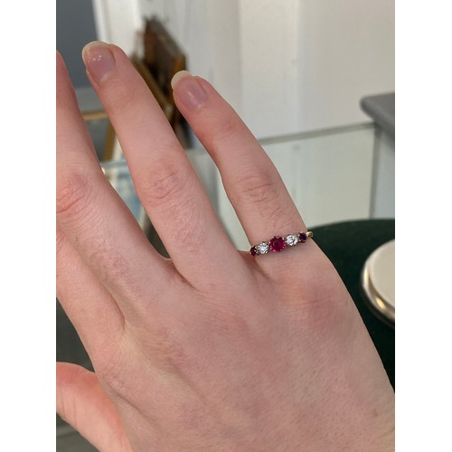 6 - An early 20th century 18ct gold, ruby and diamond five stone ring, the largest ruby 4.5mm diameter, ... 