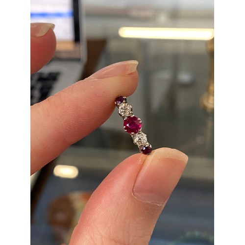 6 - An early 20th century 18ct gold, ruby and diamond five stone ring, the largest ruby 4.5mm diameter, ... 