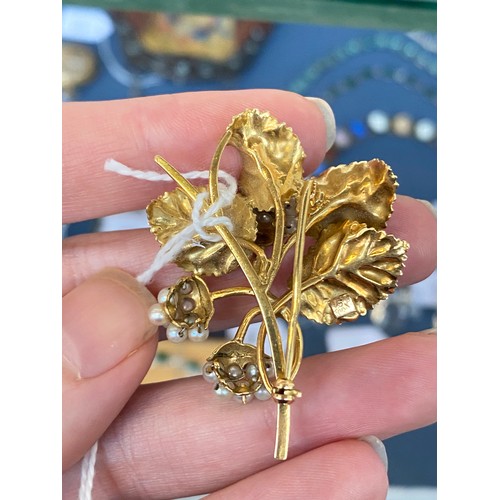 18 - A 18ct gold and seed pearl brooch naturalistically modelled as a spray of blackberries, 5cm long, 10... 