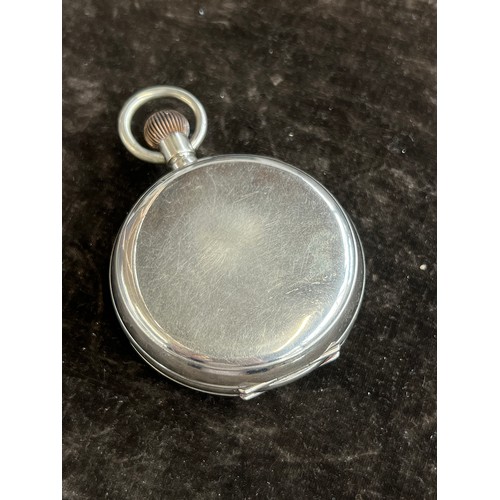 38 - A plated Goliath pocket watch, 6.2cm diameter, with a silver case, c.1900, 12cm high