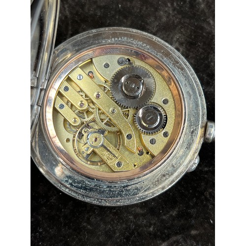 38 - A plated Goliath pocket watch, 6.2cm diameter, with a silver case, c.1900, 12cm high