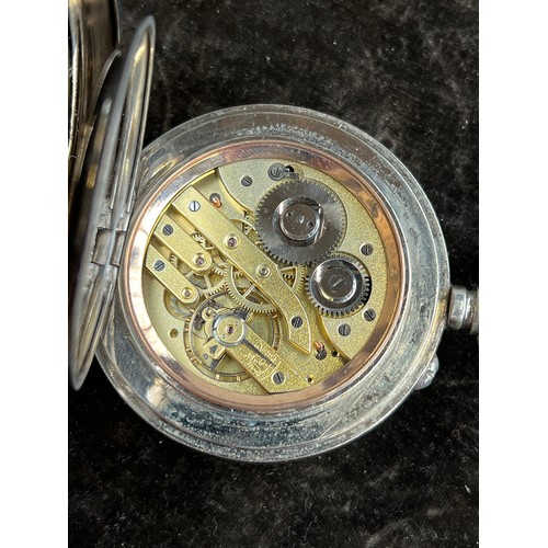 38 - A plated Goliath pocket watch, 6.2cm diameter, with a silver case, c.1900, 12cm high