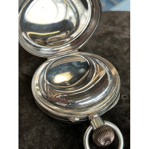 38 - A plated Goliath pocket watch, 6.2cm diameter, with a silver case, c.1900, 12cm high