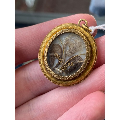19 - A Victorian gold mounted carved shell cameo brooch depicting cupid seated, 4cm long, 8.3g; together ... 