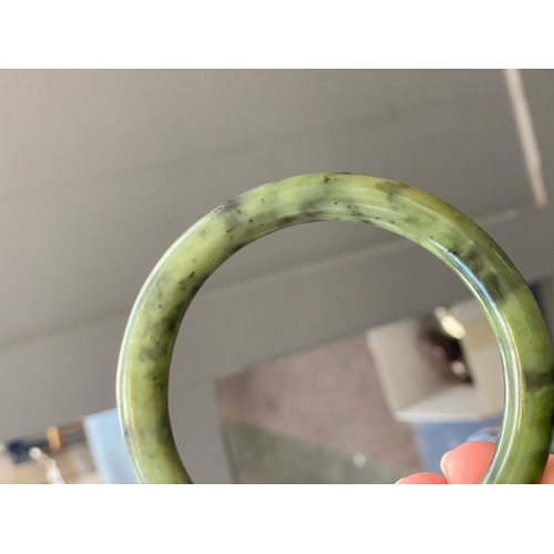 20 - A Chinese jade bangle, 40.5g, 6.3cmD internal, 8cmD overall