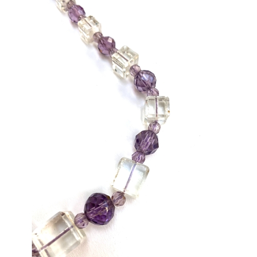 21 - An Art Deco purple and clear glass necklace, with faceted round and cube shaped beads, 38cmL