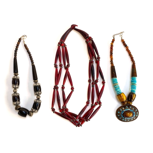 24 - Three vintage carved and stained horn necklaces
