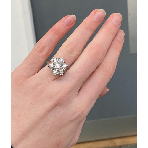 26 - A heavy 18ct white gold and diamond floral cluster ring, the diamonds each 3mmD and totalling approx... 