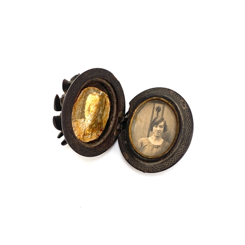 11 - A Victorian vulcanite locket, floral bouquet decoration to lid, (af), 4cmL