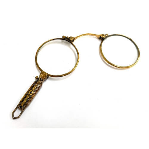 41 - A pair of late 19th century/early 20th century French lorgnettes with Taille d'epargne black enamel ... 