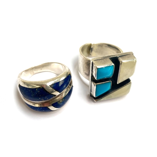 55 - A Native American style 925 silver ring of geometric form, set with mother of pearl and turquoise co... 