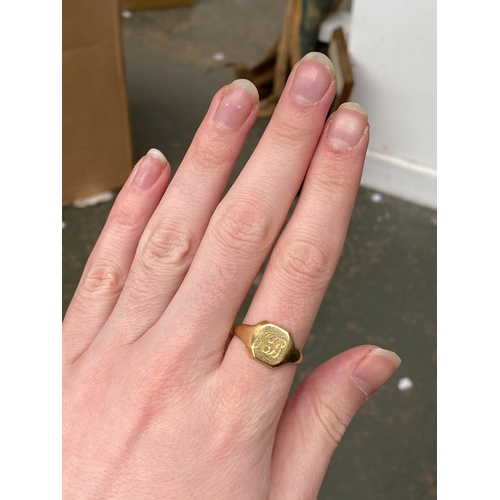 6 - A heavy 18ct gold signet ring engraved AH, size V, 7.1g