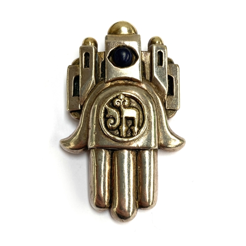 63 - Frank Meisler (Israeli, 1929-2018), a 925 silver and lapis cabochon hamsa hand brooch/pendant, signe... 