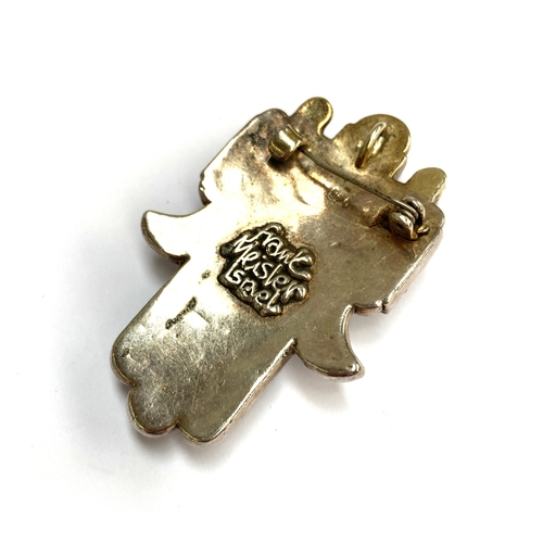 63 - Frank Meisler (Israeli, 1929-2018), a 925 silver and lapis cabochon hamsa hand brooch/pendant, signe... 