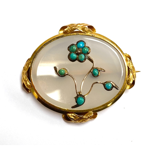 77 - A Victorian gold mounted chalcedony brooch set with a turquoise forget-me-not, tests as 15ct or high... 