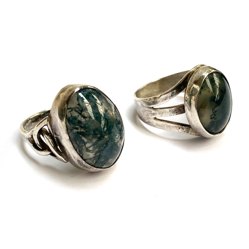 79 - Two vintage silver and moss agate cabochon rings, one with Celtic style shoulders, size M, the other... 