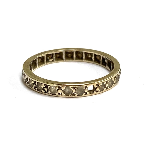 81 - An Art Deco white gold and paste set eternity ring (stones missing), unmarked but tests as 9ct, size... 