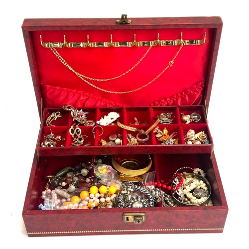 82 - A jewellery box containing a quantity of costume jewellery to include early 20th century Empire Made... 