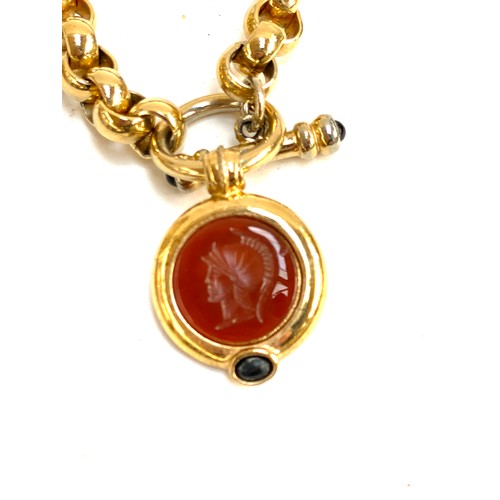 103 - A quantity of costume statement necklaces, to include a heavy gold tone chain with a Carnelian style... 