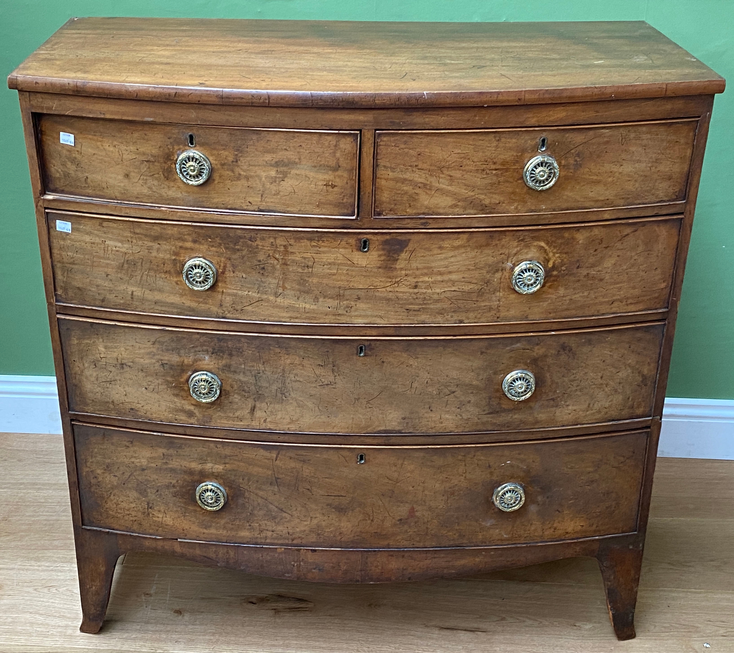 An early 19th century mahogany bowfront chest of two short over three ...