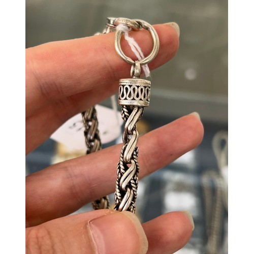 15 - A heavy 925 silver bracelet, 24.5cmL unclasped, 34.6g