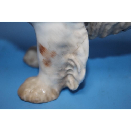 107 - A ROYAL DOULTON SPANIEL DOG TOGETHER WITH A BESWICK CHAFFINCH  (2)Condition Report:/b>The spaniel ha... 