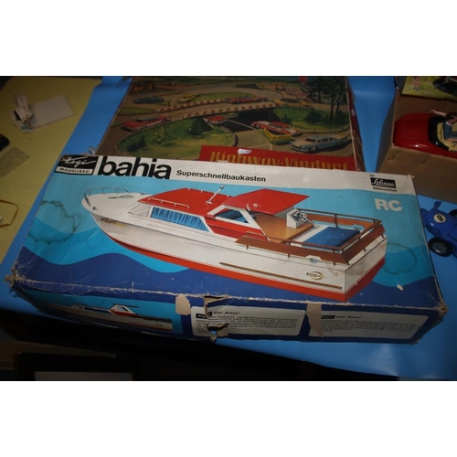170 - A BOXED PART MADE SELUCO 534 'BAHIA' MODEL MOTOR YACHT together with a battery operated Vanwall Gran... 