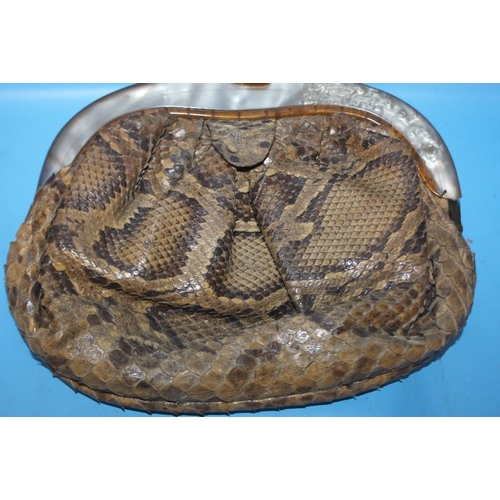 69 - A SNAKESKIN CLUTCH BAG WITH MOTHER OF PEARL, W 23 cm, H 20 cm