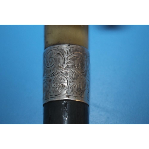83 - A HALLMARKED SILVER COLLARED WALKING CANE TOGETHER WITH ANOTHER WHITE METAL TOPPED CANE