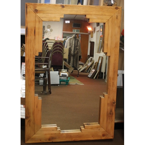 11 - A PINE FRAMED MIRROR 133.5 X 89 CM