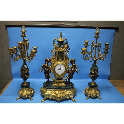 98 - A REPRODUCTION FRENCH STYLE CLOCK GARNITURE IN GILT METAL AND GREEN MARBLE