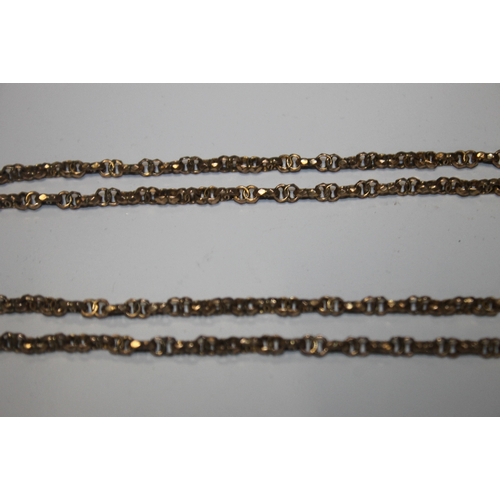 127 - A VICTORIAN YELLOW METAL GUARD CHAIN