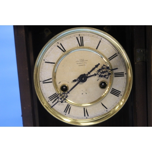 89 - AN ANTIQUE WALNUT CASED MANTEL CLOCK