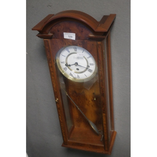109 - A HANGING WALLCLOCK