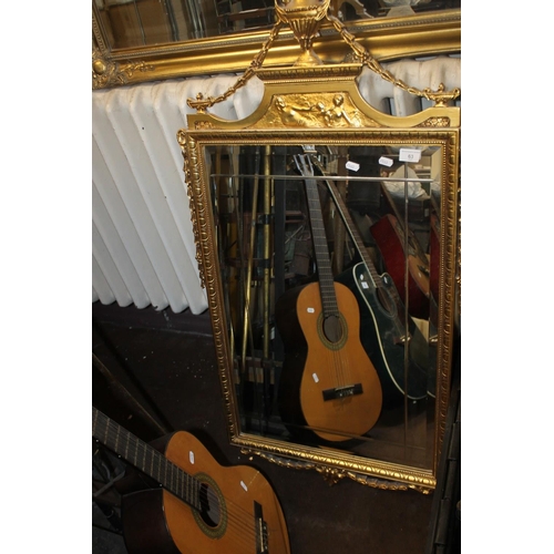 63 - A DECORATIVE GILT MIRROR, 116 X 62 CM