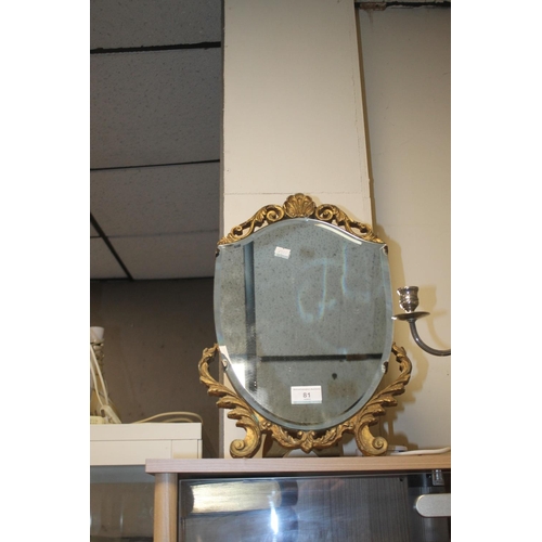 81 - A SHIELD SHAPED DRESSING TABLE MIRROR