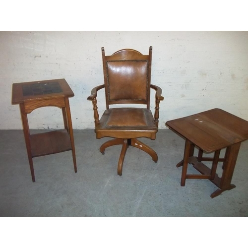 757 - AN ANTIQUE OAK SWIVEL CHAIR AND A TILE TOPPED OAK TABLE TOGETHER WITH A DROP LEAF OAK TABLE